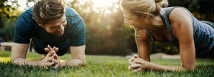 Two people planking 