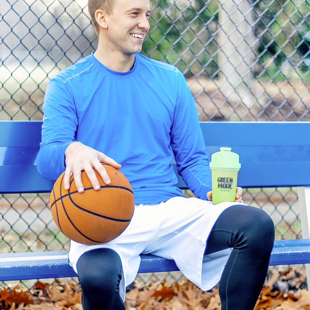 Man holding basketball and BIOHM Shaker 